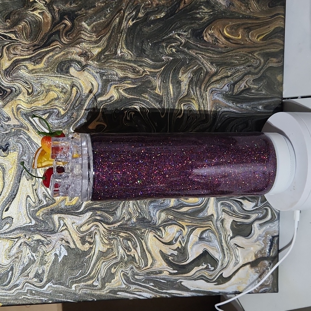 Glitter speaker tumbler with ice and fruit topper